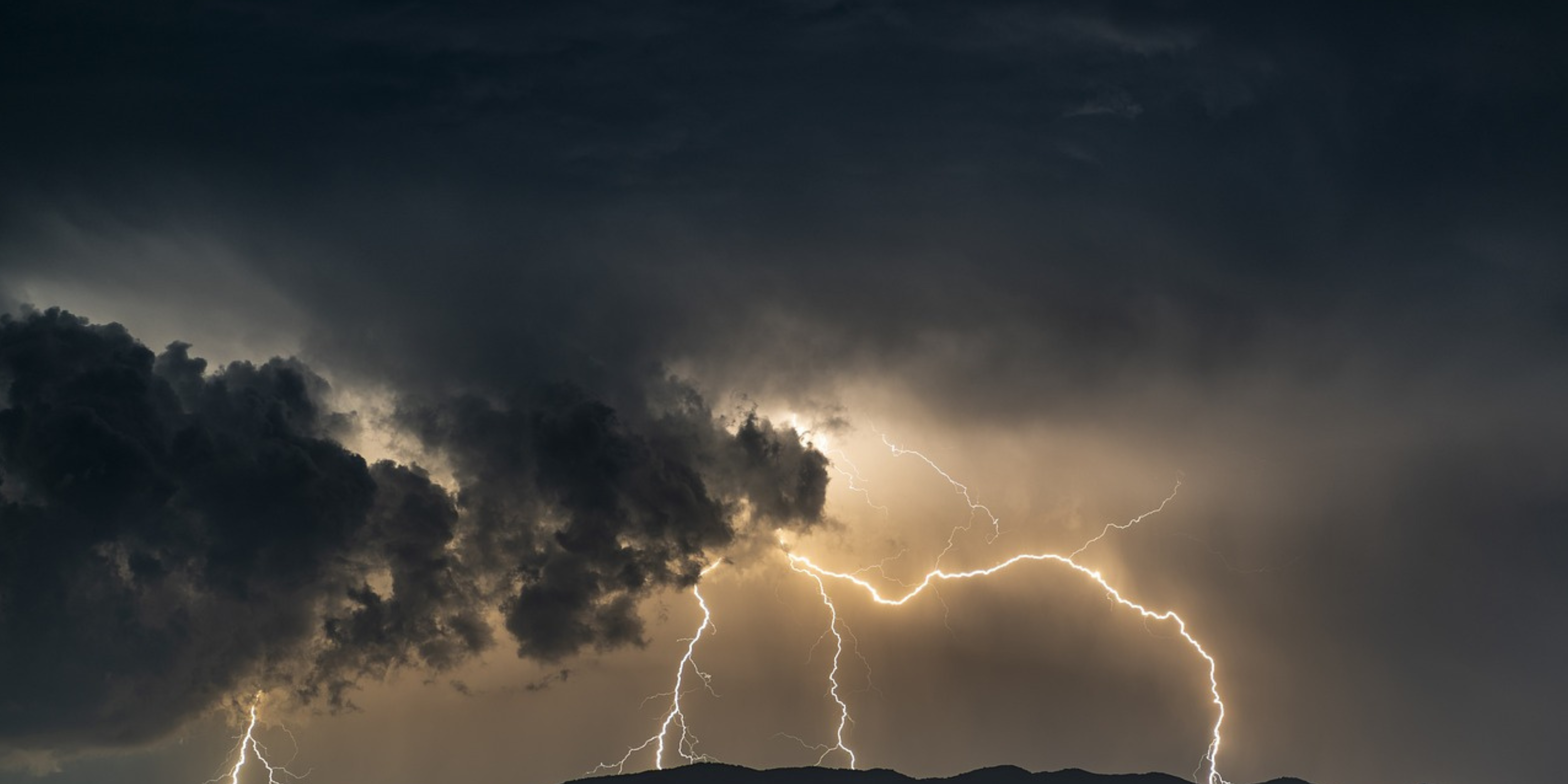 Image of sky with dark clouds and lightning to illustrate the problem of foreign cloud services